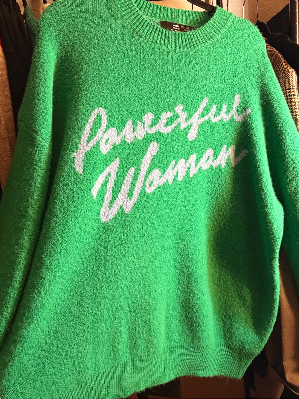 Dressed in LALA Green Sweater with White 'Powerful Woman' Script